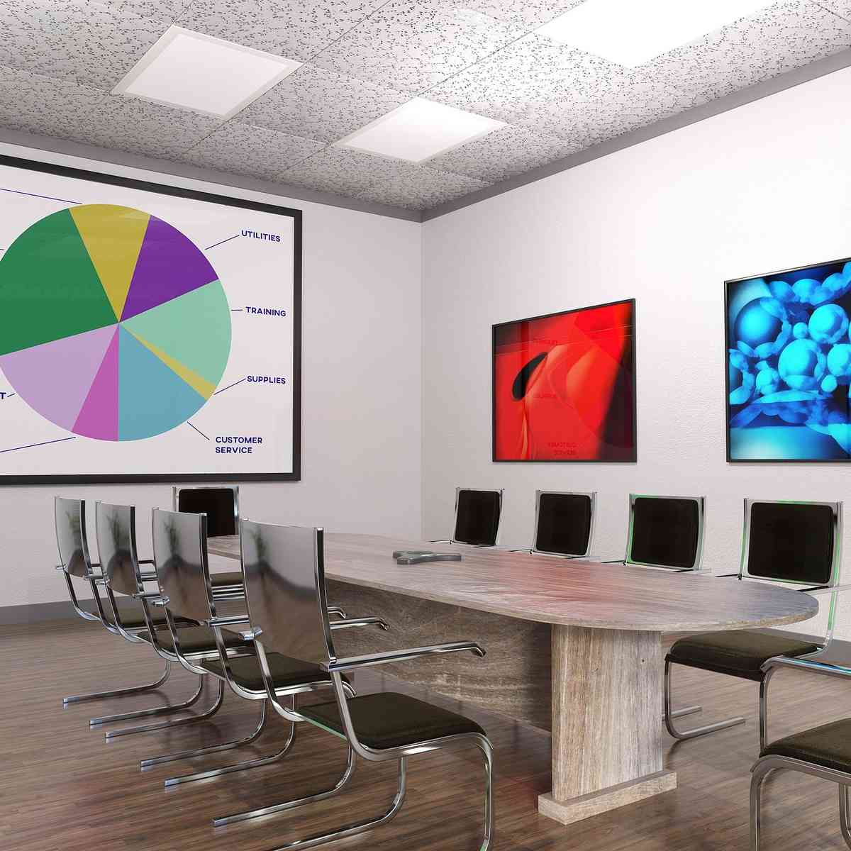 Une salle de réunion moderne avec table, chaises, écran et œuvres murales Une salle de réunion moderne avec table, chaises, écran et œuvres murales